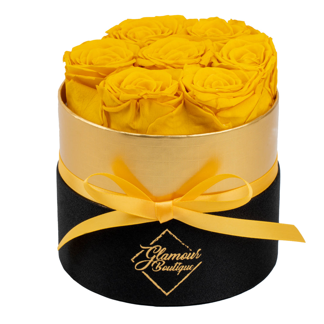 Lasting Beauty round black gold box with 7 yellow preserved roses by Glamour Boutique
