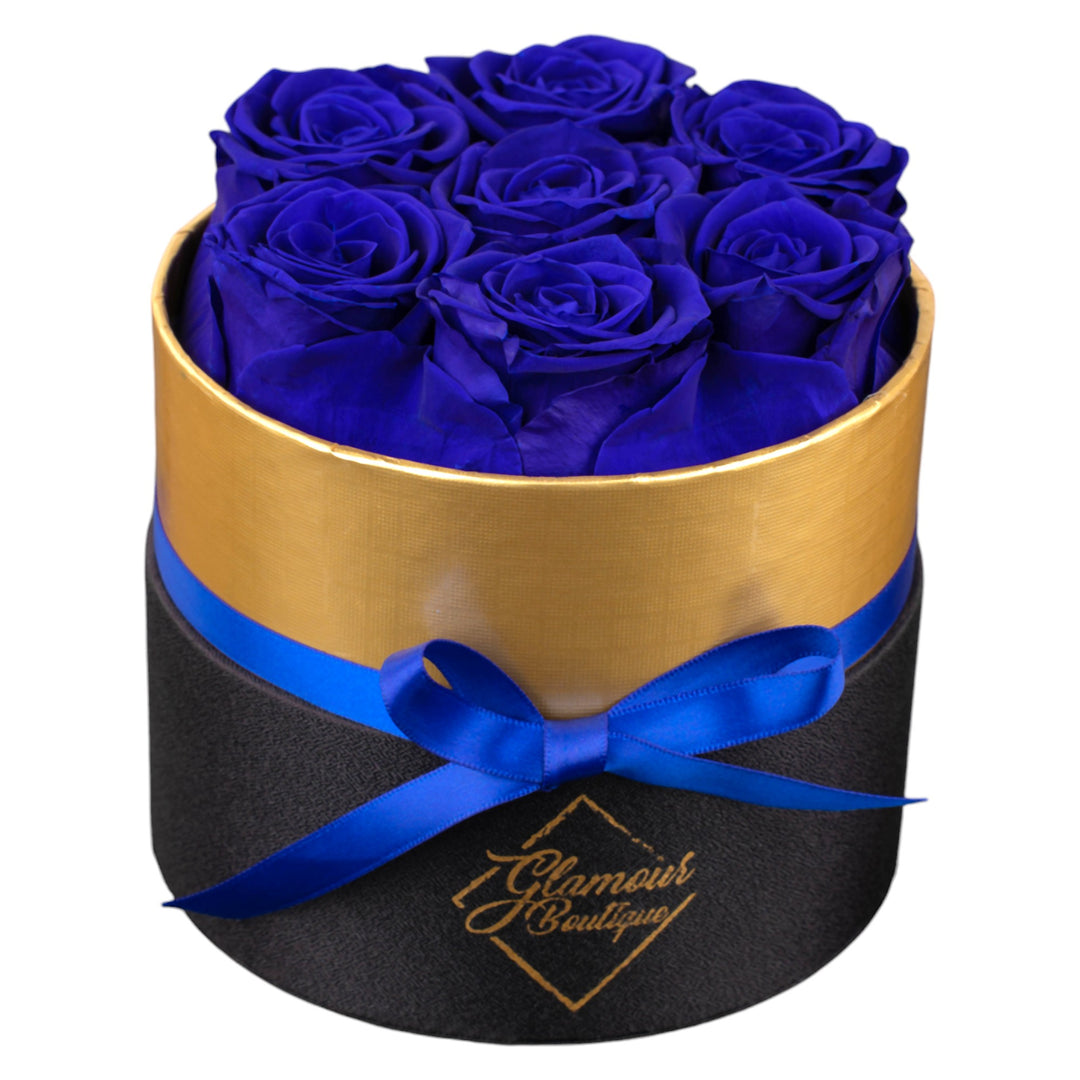 Lasting Beauty round black gold box with 7 blue preserved roses by Glamour Boutique