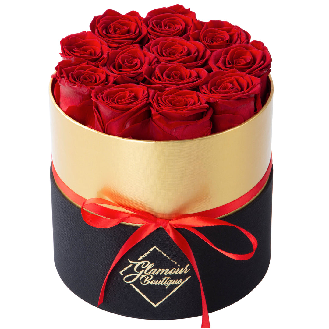 Lasting Beauty round black gold box with 12 red preserved roses by Glamour Boutique