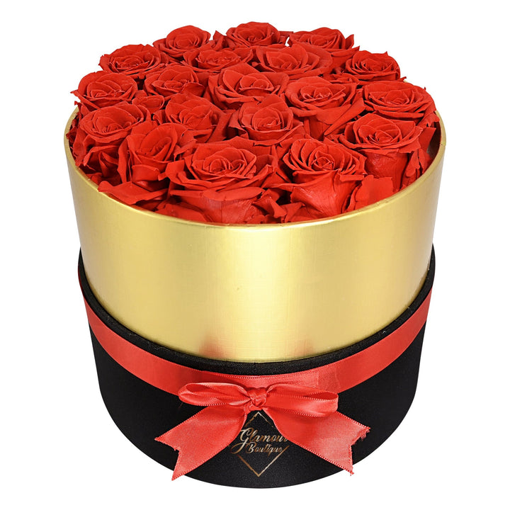 Lasting Beauty round black gold box with 19 red preserved roses by Glamour Boutique